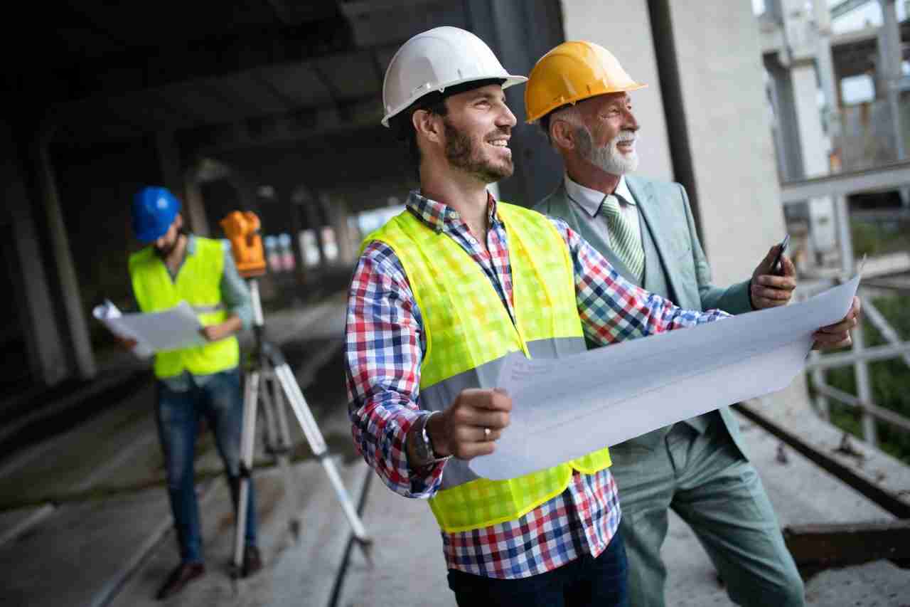 construction engineer with foreman worker checking construction site Construction Engineer With Foreman Worker Checking Construction Site by HQ Remodeling