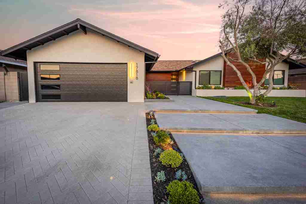 Front yard remodeling with driveway fountain valley ca Modern home with a sleek driveway and landscaped yard in Fountain Valley, CA.