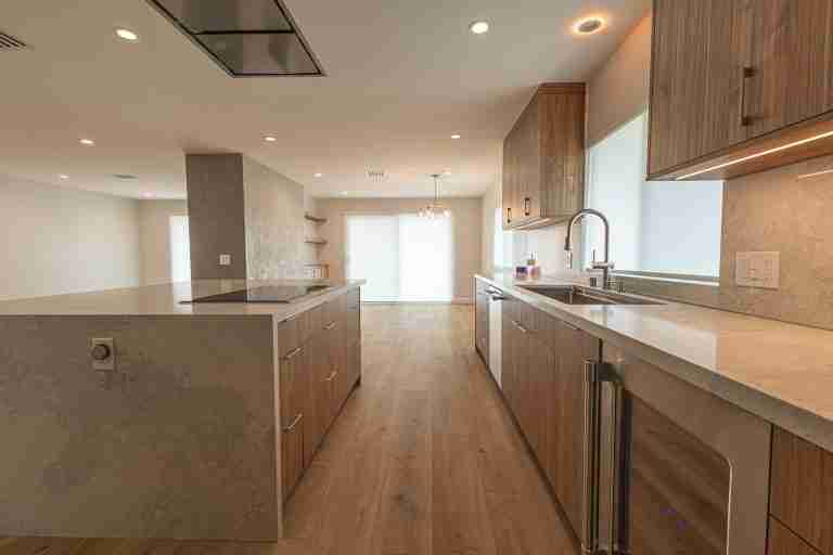 Modern kitchen with wooden cabinets and spacious countertops. Fountain Valley CA