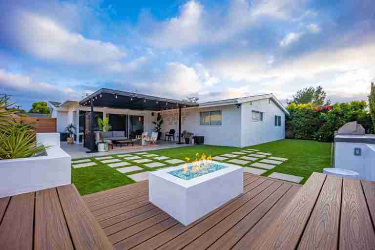 Beautiful backyard with modern patio, fire pit, and cozy seating area in Anaheim, CA.