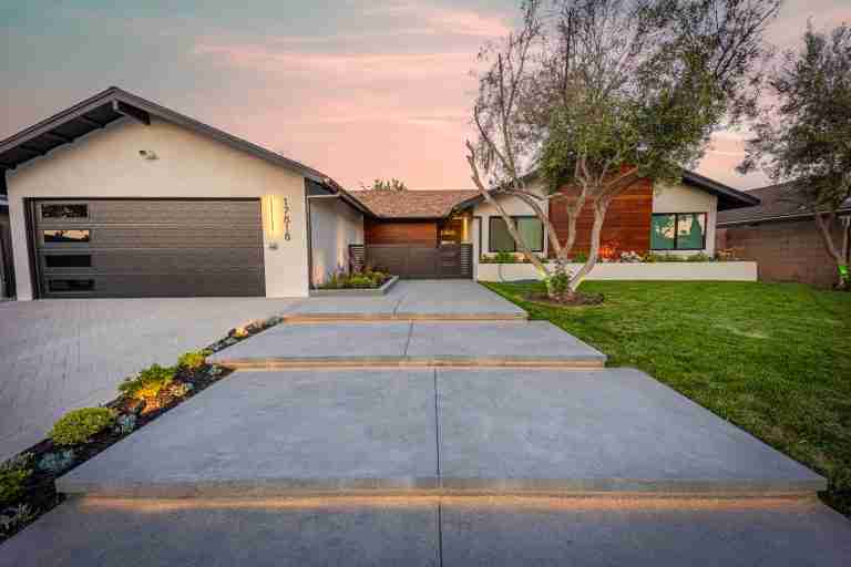 front yard concrete remodeling in orange ca Bright and welcoming front yard with a contemporary house design in Orange, CA. Perfect for curb appeal