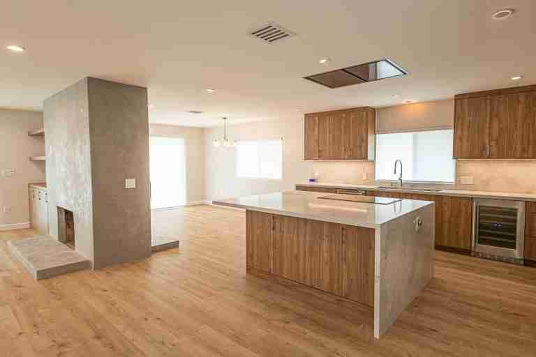 Modern kitchen with wooden cabinets and island for cooking and entertaining. Buena Park, CA