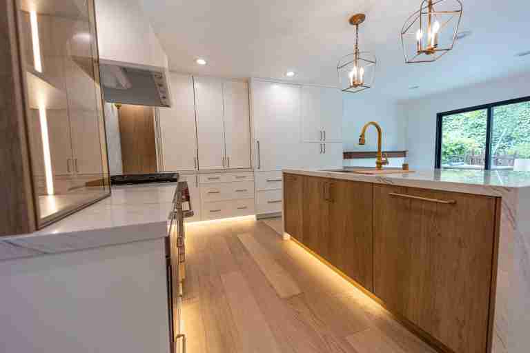 kitchen remodeling white orange ca Bright, modern kitchen with white cabinetry and a central wooden island for cooking and entertaining in Orange CA