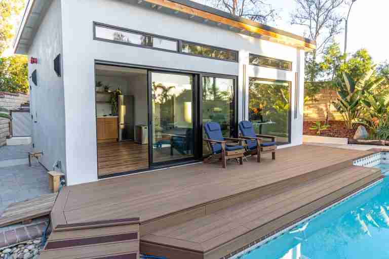 Modern backyard pool with wooden deck in Tustin CA.